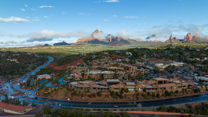 Aerial view of Sedona, Arizona with clouds covering some of the mountains.