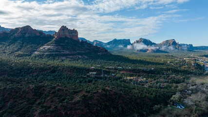 Fototapeta na wymiar Aerial view of Sedona, Arizona with clouds covering some of the mountains.