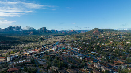 Aerial view of Sedona, Arizona with clouds covering some of the mountains.