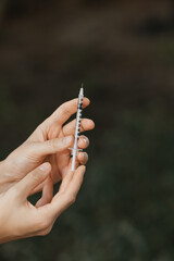 Cosmetic syringe in hands of a Cosmetologist and beauty industry doctor beauty