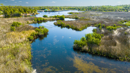 Fototapeta na wymiar Florida Sawgrass Aerial Photo From Drone. Saw grass, a common name of some species of plants in the genus Cladium; Sawgrass, Florida, a town in the United States