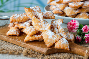 Traditional Italian carnival fritters dusted with icing sugar - frappe or chiacchiere