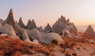 Fototapeta premium Landscape sunrise in Cappadocia with set colorful hot air balloon fly in sky with sun light. Concept tourist travel Goreme Turkey