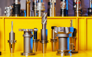 Set new drills and cutters for automatic metal processing CNC machine. Industrial tool equipment for iron factory