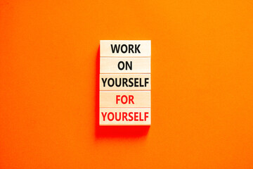 Work for yourself symbol. Concept words Work on yourself for yourself on wooden block. Beautiful orange table orange background. Business and work for yourself concept. Copy space.