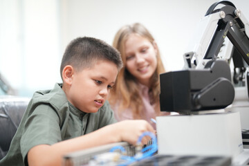 Children learning AI technology Robot with artificial intelligence system on its about the artificial intelligence during science lesson.