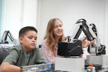 Children learning AI technology Robot with artificial intelligence system on its about the artificial intelligence during science lesson.