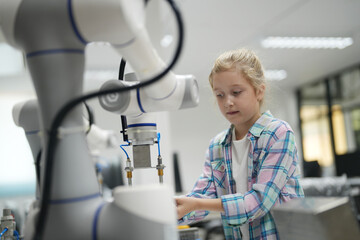 Children learning AI technology Robot with artificial intelligence system on its about the artificial intelligence during science lesson.