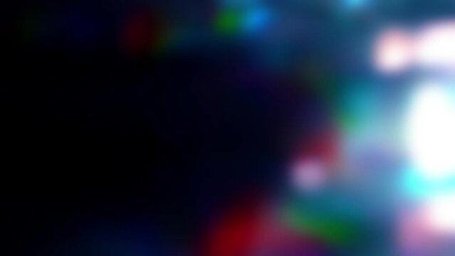 Abstract background with blurred rainbow colors on a black background. Abstract long video with holographic effect and space for text. The concept of manufacturability and naturalness in 4k.