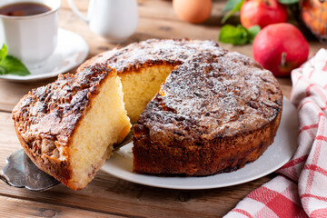Fototapeta na wymiar Sponge cake with apples on a table, selective focus. Homemade cake