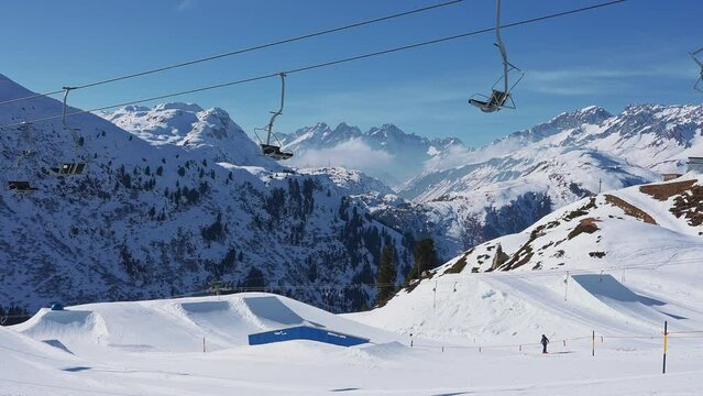Snow park at the St. Anton am Arlberg ski resort. People skiing down the snow park.