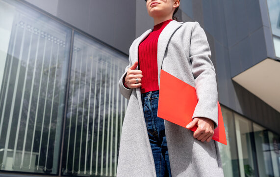 Confident female entrepreneur going to the office.