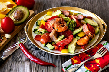 Seafood salad with fresh vegetables and sauce.