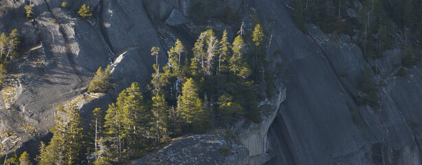 Rocky cliffs on Chief Mountain in Squamish, BC, Canada. Nature Background. Sunny day.