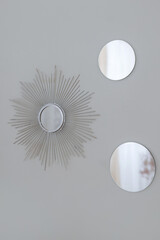Silver round wall mirrors framed by Sun-Ray. Silver Sun Vintage Art Deco decorative mirror for living room and bedroom. Attractive wall-mounted classic round mirror.