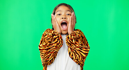 Girl child, shock face and green screen studio with tiger pyjamas, costume and wow with hands on...