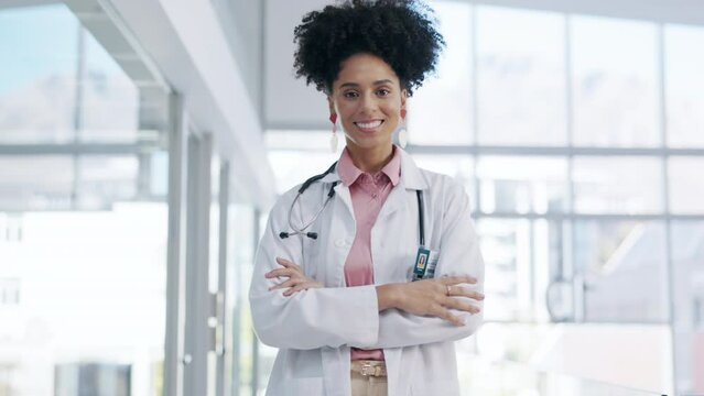 Doctor, woman and face with arms crossed in confidence for healthcare profession or career at the hospital. Portrait of confident female medical consultant expert smiling for life insurance at clinic