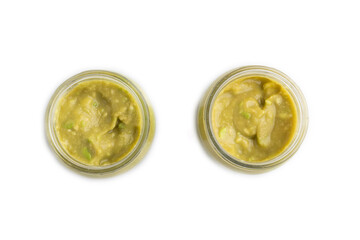 Baby puree with vegetable mix, broccoli, avocado in glass jar isolated on white, top view