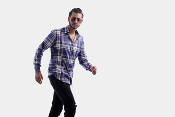 Handsome man posing in isolated white studio background wearing shirt