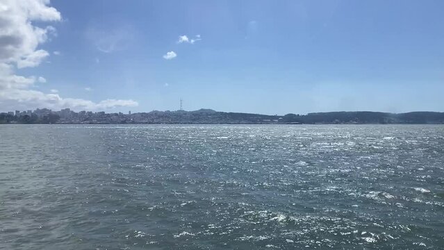 San Francisco skyline, featuring Sutro Tower, as seen from the San Francisco Bay on a beautiful, sunny day.