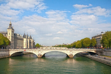 Obraz premium Panorama of Paris (France) with the Pont au Change over the Seine River and the former Royal Castle and the Conciergerie Prison (La Conciergerie) on the left bank.