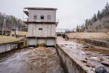 A small hydroelectric power station is located on the river in spring