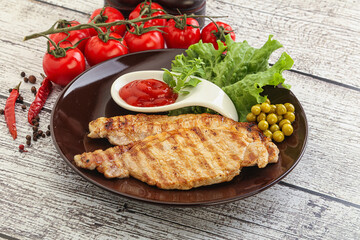 Grilled pork steak with ketchup