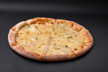 Delicious fresh hot pizza four cheeses cut into pieces