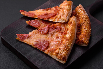 Delicious fresh pepperoni pizza with sesame seeds on the sides