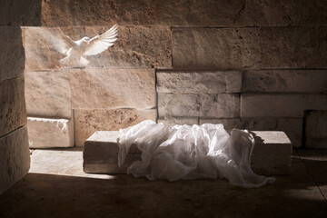 Jesus Christ crucifixion death and resurrection and easter dove flying in a stone tomb - obrazy, fototapety, plakaty