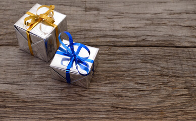 Gift boxes on wooden board background.