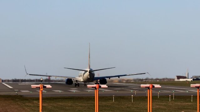 Copenhagen, Denmark A jet passenger airplane on the runway at Kastrup airport lifts off.