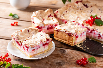 Redcurrant cheesecake, tart with fresh berries on wooden table