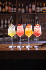 cocktails in a cafe on a wooden table, colorful summer cocktails with ice