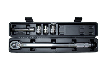 torque wrench in a case on a white background. Adjustable torque wrench spanner hand tool and different nuts.
