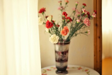 Bouquet of asters flowers on a table with a linen tablecloth