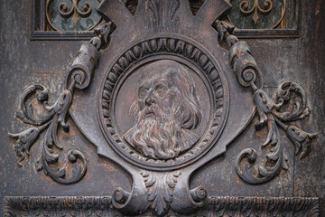 Lviv, Ukraine - March, 2023: decorative element of the magnificent baroque portal at the Teatralna street of the Saints Peter and Paul Garrison Church.