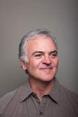 Studio portrait of smiling mature man.