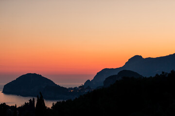 Beautiful red sunset over Liapades Beach, Corfu, Greece