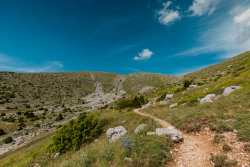 Fototapeta na wymiar Mountain path in Vikos National Park near Tymfi's mountain refuge in Pindus Mountain, Greece