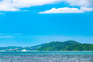 Tropical paradise turquoise water beach  limestone rocks Phuket island Thailand.