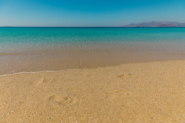 Fototapeta na wymiar Beautiful empty beach Agios Prokopios on Naxos Island with turquoise sea lagoon