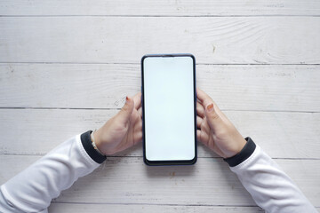 child hand holding a smart phone with empty space 
