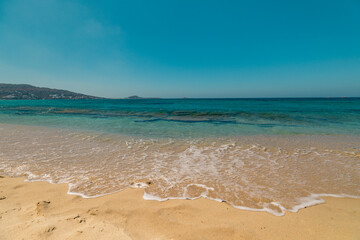 Fototapeta na wymiar Beautiful empty beach on Naxos Island with turquoise Mediterranean sea 