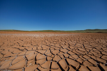 A fully dried and cracked soil layer over an extinct water reserve site in Turkey.