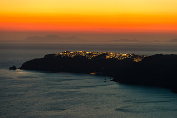 Santorini, Grece - July 23, 2020 -  Amazing red sunset over Oia and caldera of the Santorini island, Greece