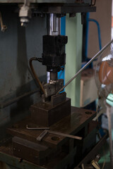 Work of bending the cut material with a press machine
