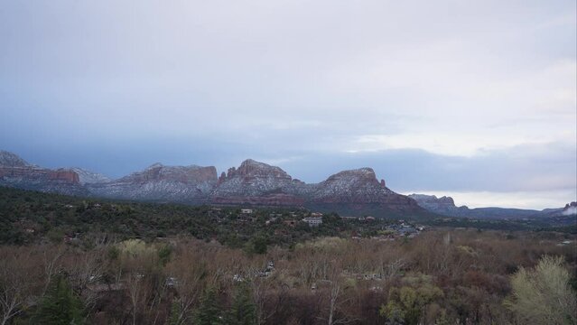 Timelapse of clouds and snow moving over the Snoopy Rock in Sedona, AZ.
