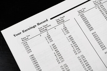 Obraz premium Abstract of a Social Security Statement earnings record.