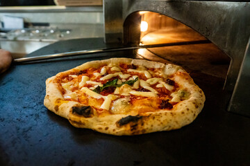 Pizza Napoletana Italian Pizza in the making by cook 